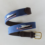 Navy Yachtsman needlepoint belt with two stitched motor yachts, leather tab and brass buckle